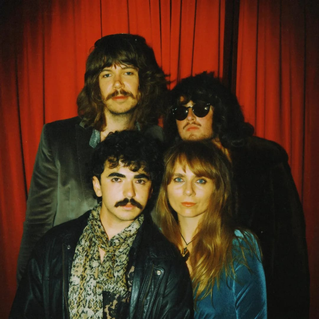 Big Wheels in front of a red curtain. Photo: Jordy Rudan